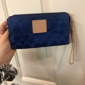 blue coach cloth wrist wallet with orange interior